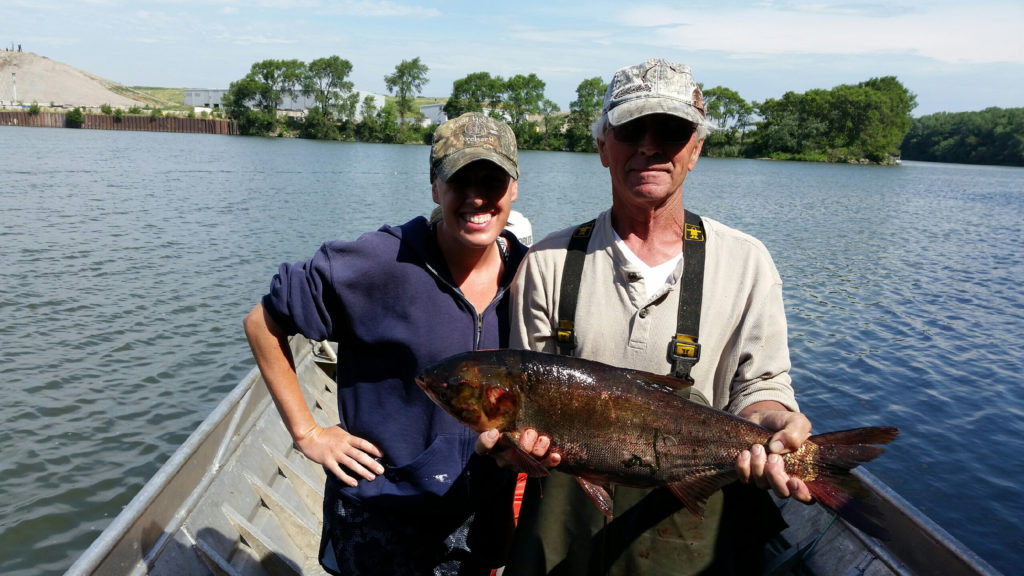 Asian Carp caught by a happy fisherman.