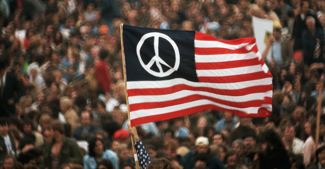 An American Flag with a peace sign on it
