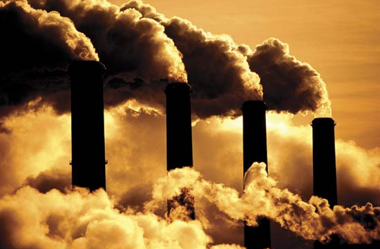 Smokestacks spew pollutants from coal burning