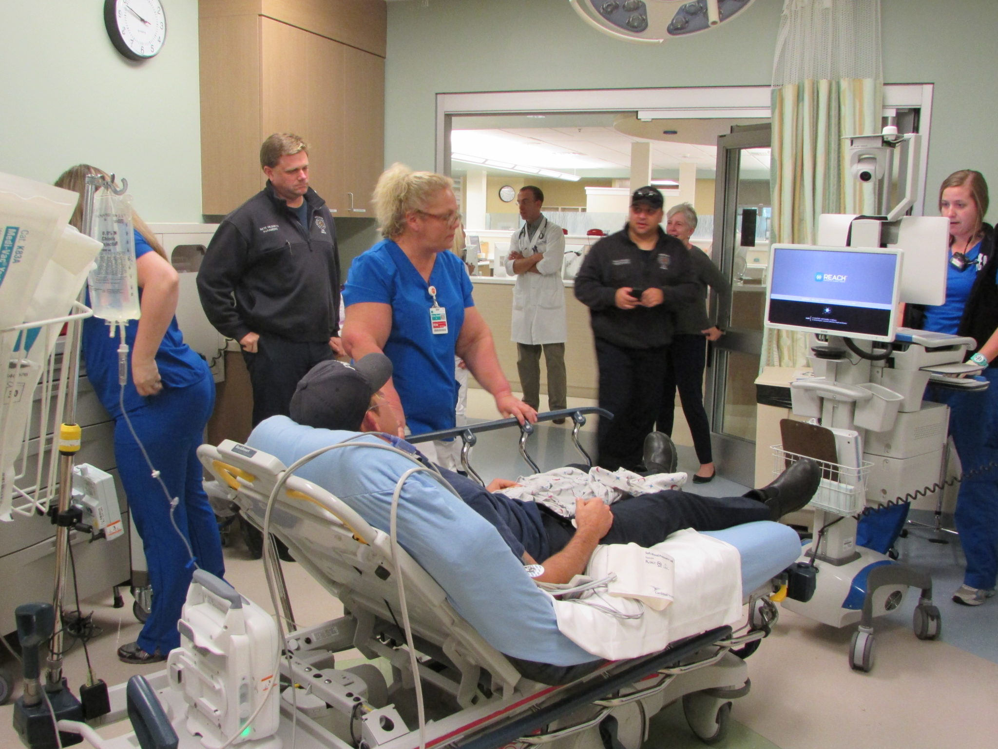 Doctors and patients in an emergency room.