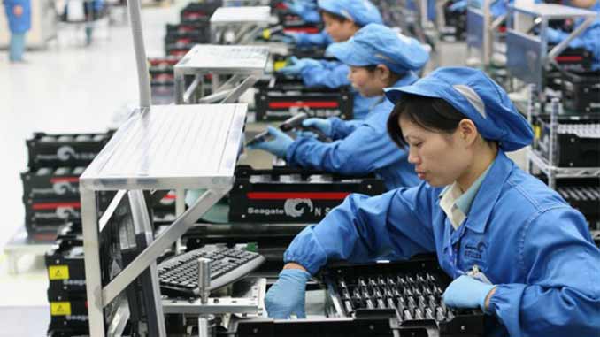 With New Tariffs, Trump Makes His Move on China Workers at a factory in China.