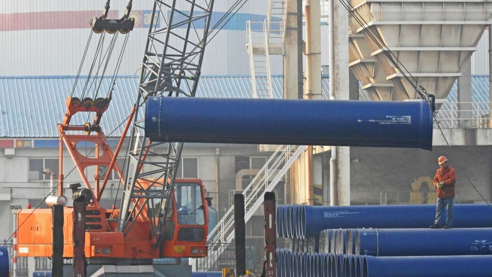 Steel Shipments being unloaded from a ship