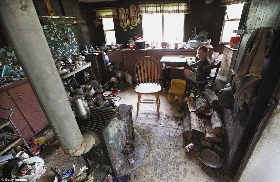 How Radical Republicans Punish Poor People A picture of a poor woman at the kitchen table