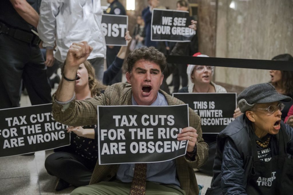 Protesters upset Republicans bleeding government dry.
