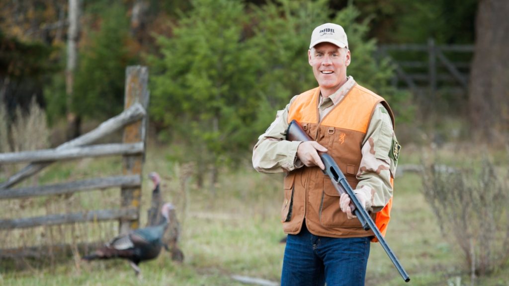 Now It’s Zinke Whose Back Is Against the Wall Interior Secretary Zinke in hunting gear with a rifle.