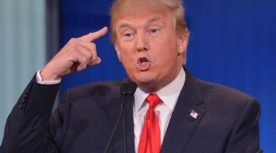 Trump pointing at his head.