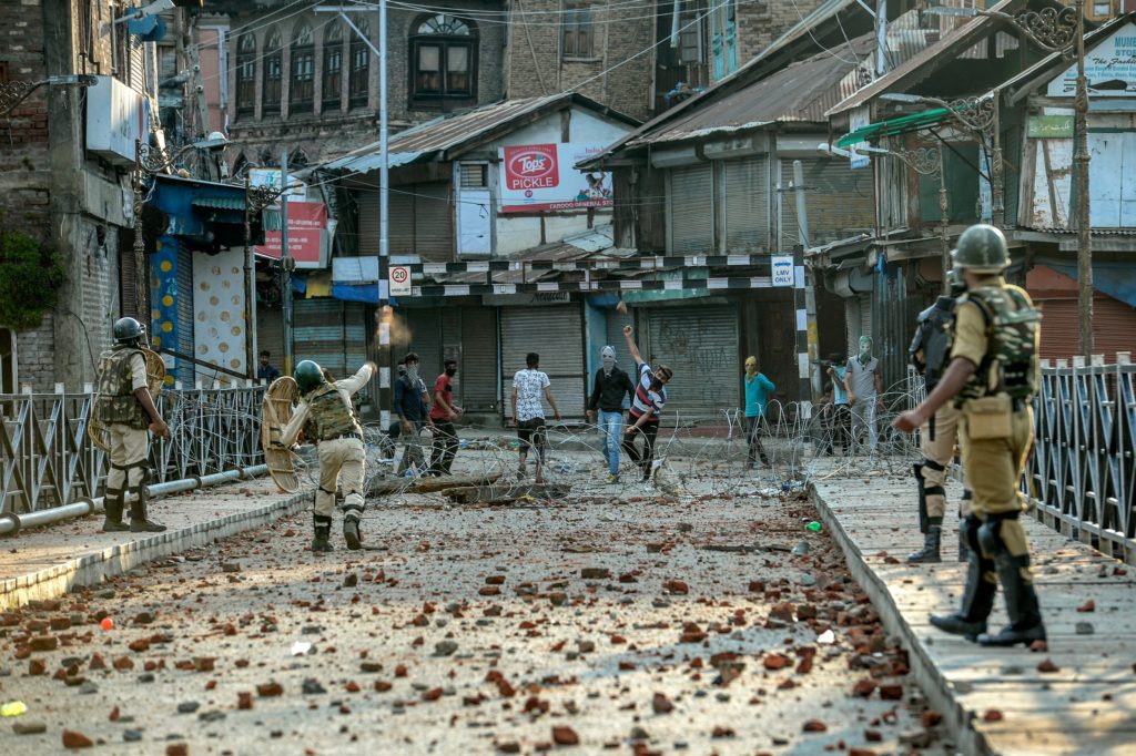 Protesters throwing stones in Srinagar, in Indian-controlled Kashmir.