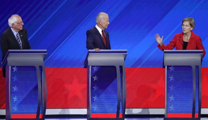 Bernie Sanders, Joe Biden, and Elizabeth Warren on the debate stage.