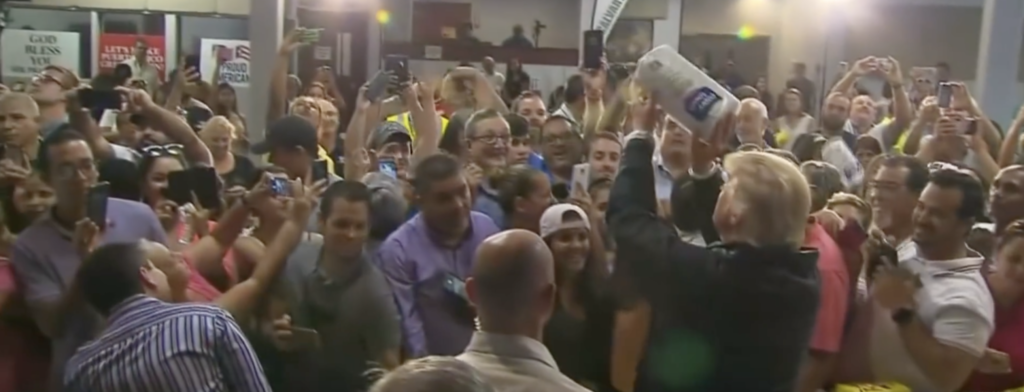 Trump throws paper towels to Puerto Ricans after hurricane.