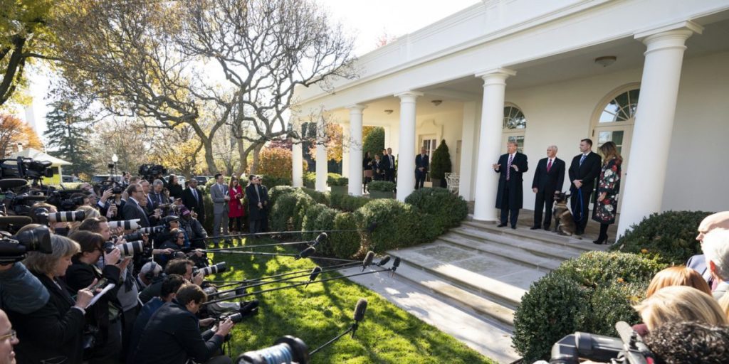 Trump speaks on the steps of the White House.