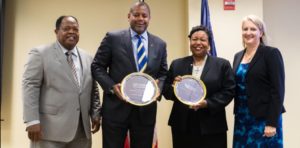Warren S. Whitlock (second from left) received the Defense Department's Outstanding Workforce Recruitment Program Component Award in 2017. (Dept. of Labor photo)
