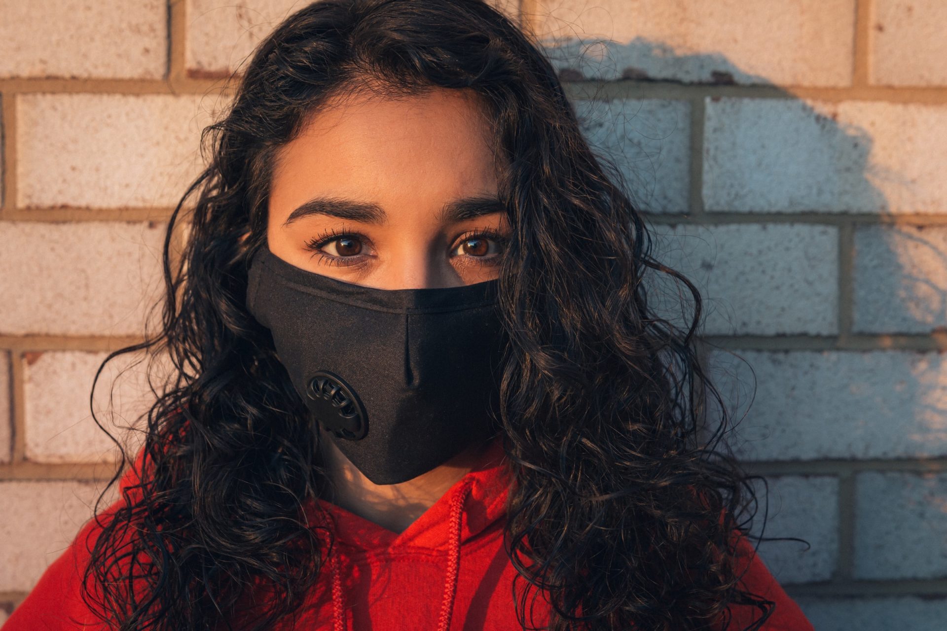 Average Wages: A working woman in a mask.