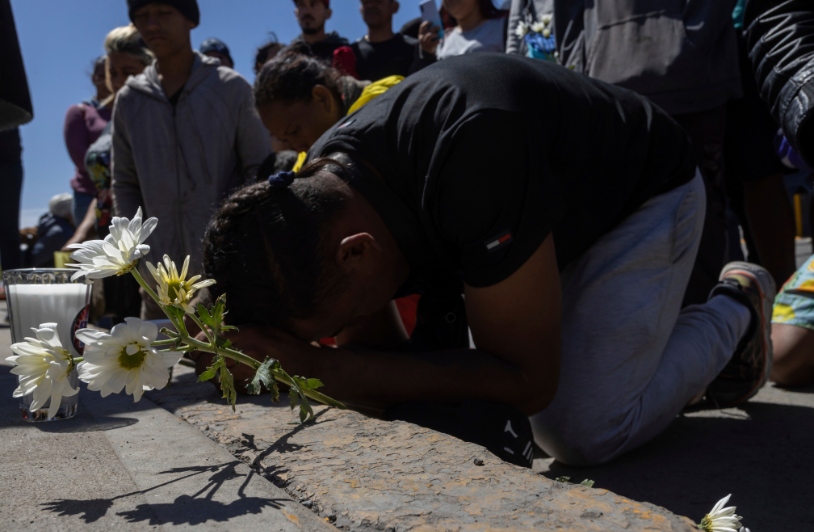 Mourners gather outside a detention center for migrants in Ciudad Juarez.