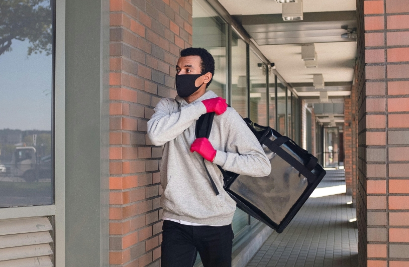 Man delivering food to residence.
