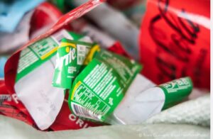A close-up of crushed Sprite and Coca-Cola plastic bottles.