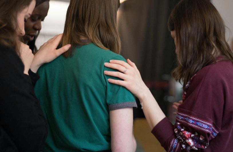 Empowering Communities Through Advanced Health Education Four women looking down.