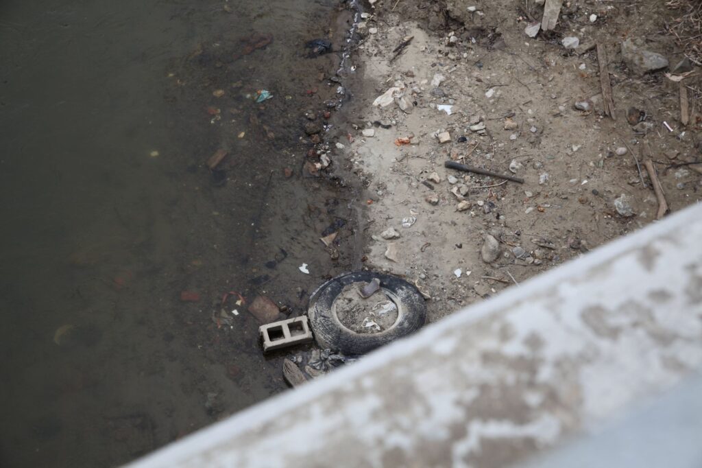 Tire on the shore of the Flint River
