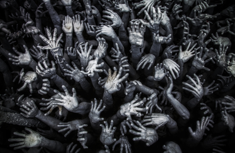 Hands raised in delusion and chaos