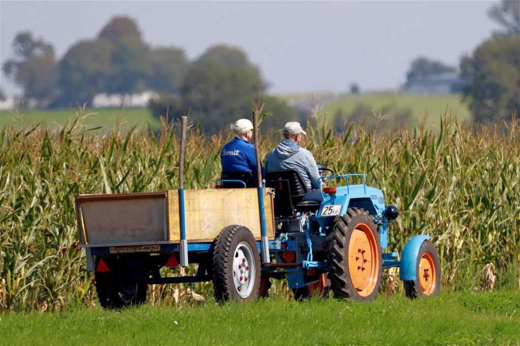 Farmers on tractor