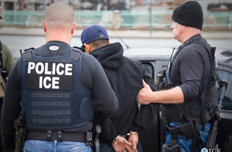 ICE arresting detainee.