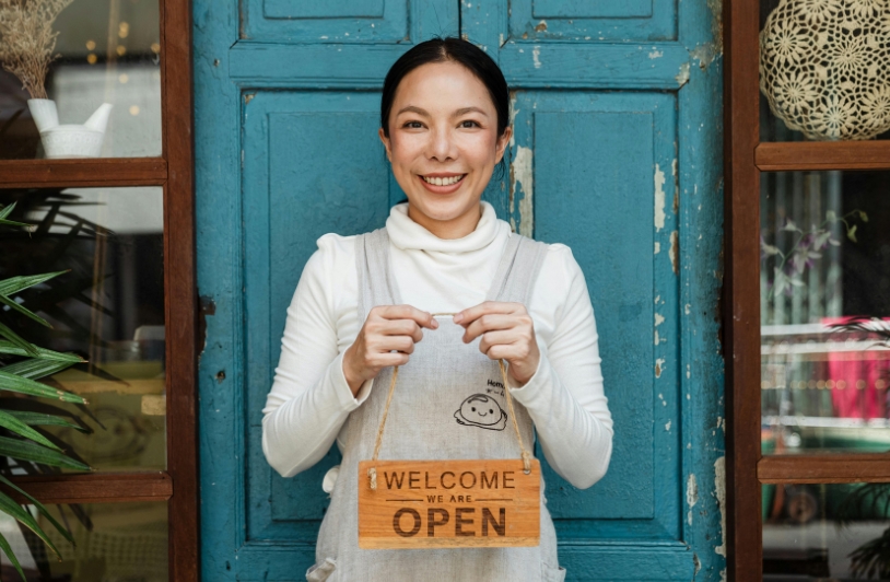 Woman in front of small business