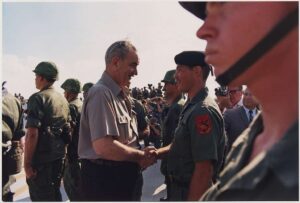 President Lyndon B. Johnson shakes hands with a soldier during a visit to Vietnam.