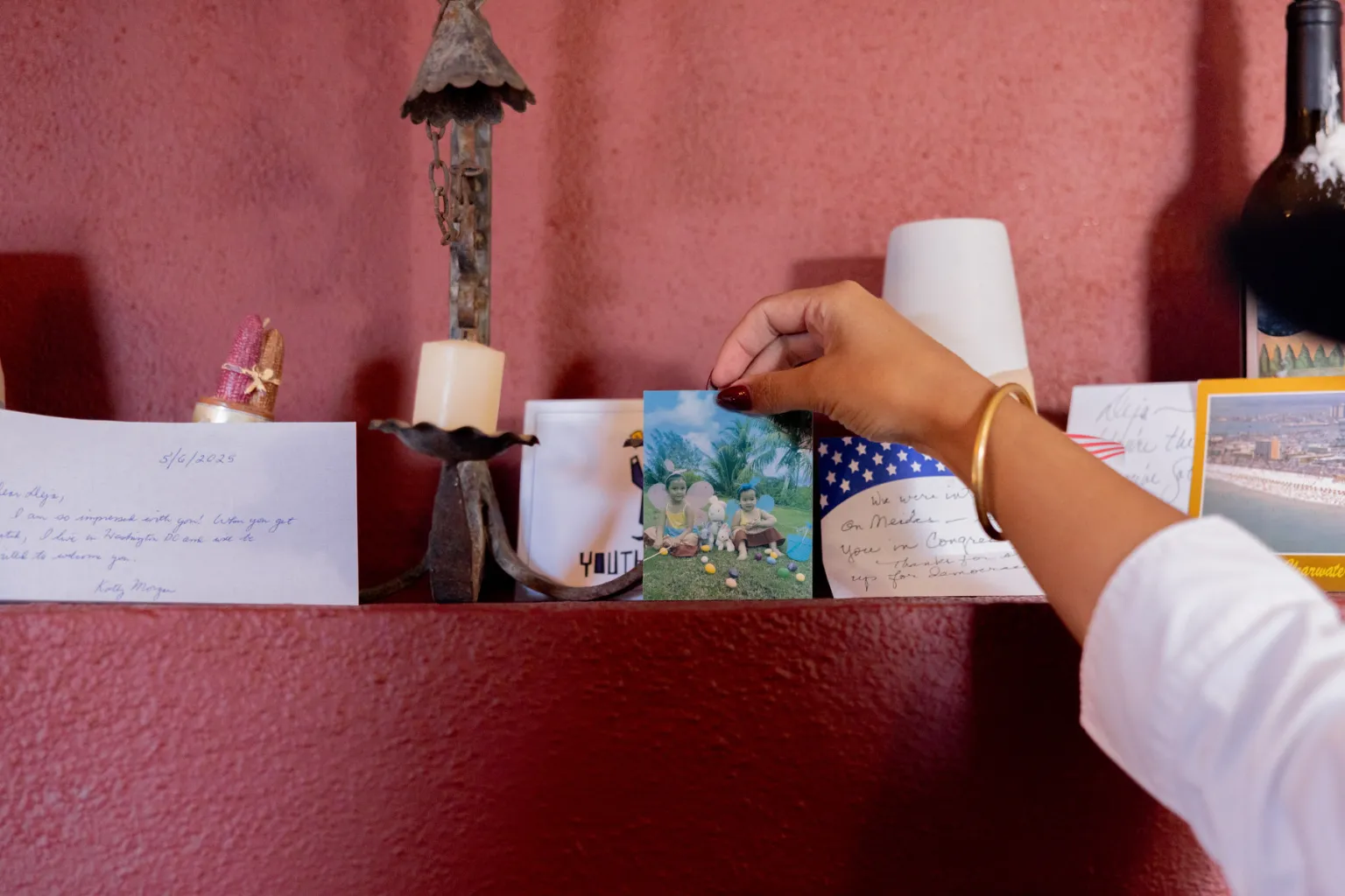 A woman reaches for a card