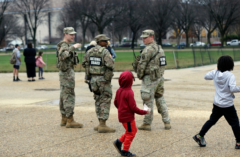 National Guard troops with children