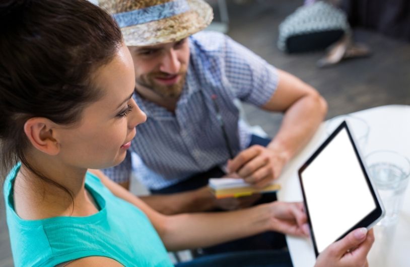 Couple using digital tablet