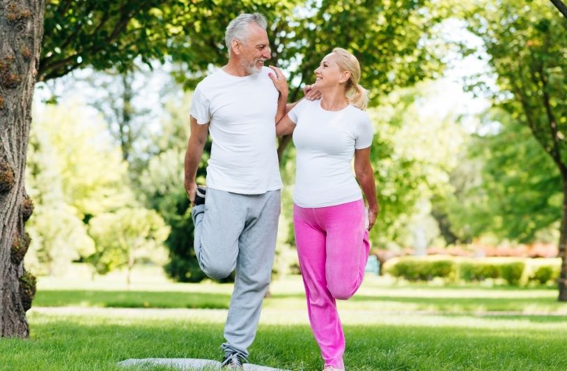 Full shot people exercising together