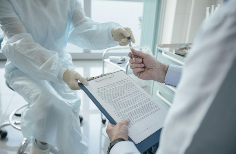 Doctor handing a Document