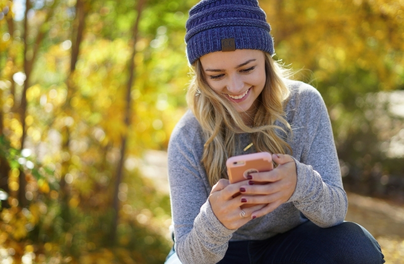 woman gaming on phone