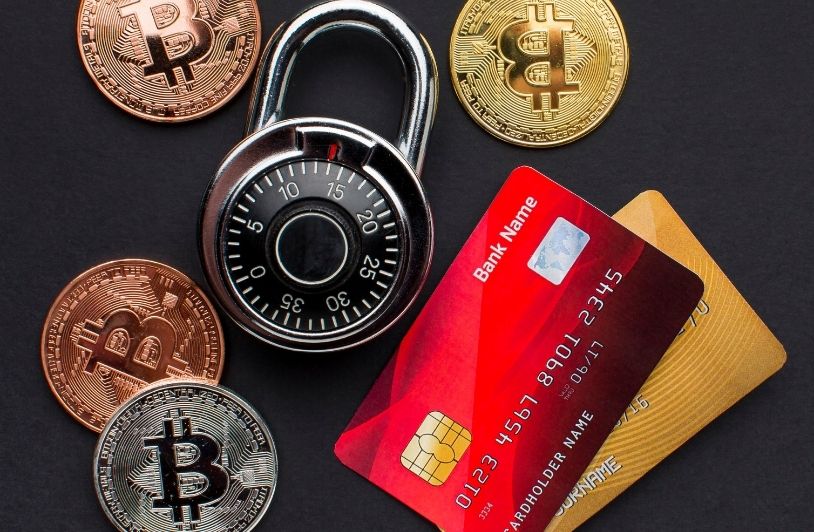 Credit Cards and Bitcoin: What Buyers Should Know Before They Click “Purchase” Top view of credit cards with lock and bitcoin