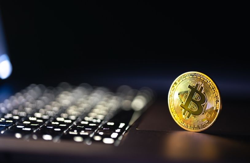 Bitcoin coin on keyboard with nice background crypto money concept