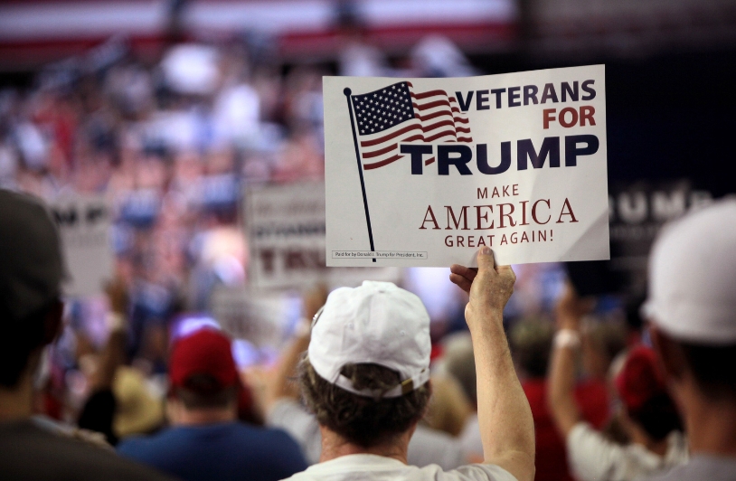 Work With Trump Voters, but Don’t Forgive Them Trump follower holding sign