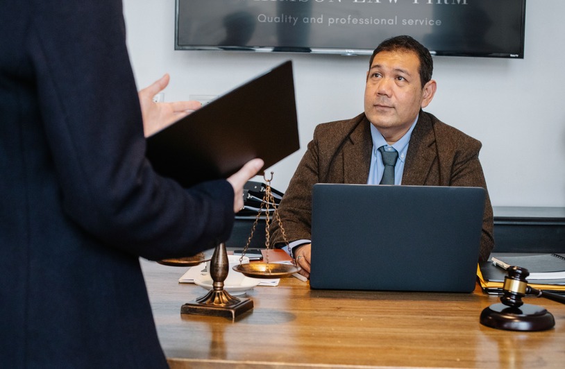 Boost Your Law Firm Through Local SEO Lawyer at desk.
