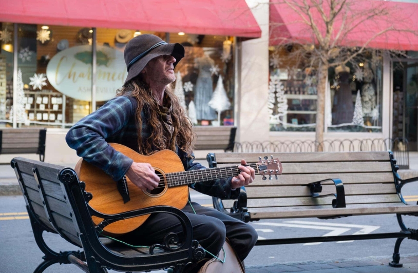 Man playing guitar.
