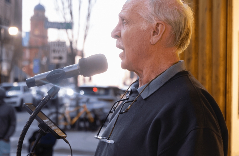 A man singing in the streets.