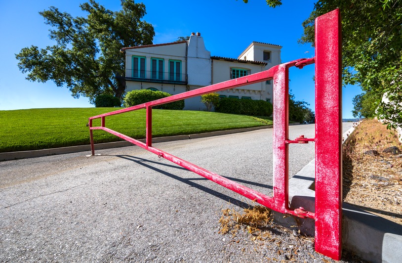A modern residential automatic gate at the entrance of a home