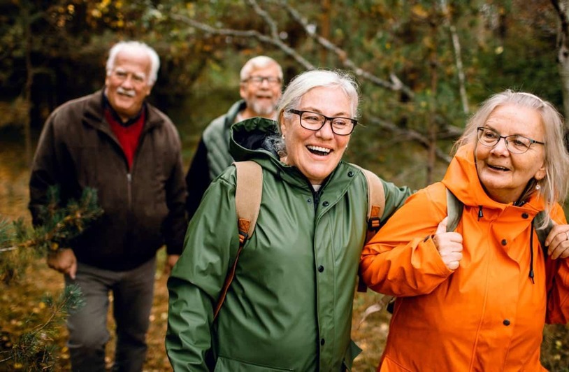How Rural Seniors Can Access Better Healthcare Services An elderly person speaking with a healthcare provider in a rural clinic setting