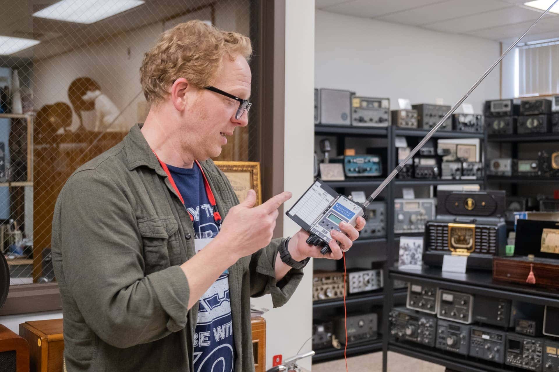Man holding radio equipment