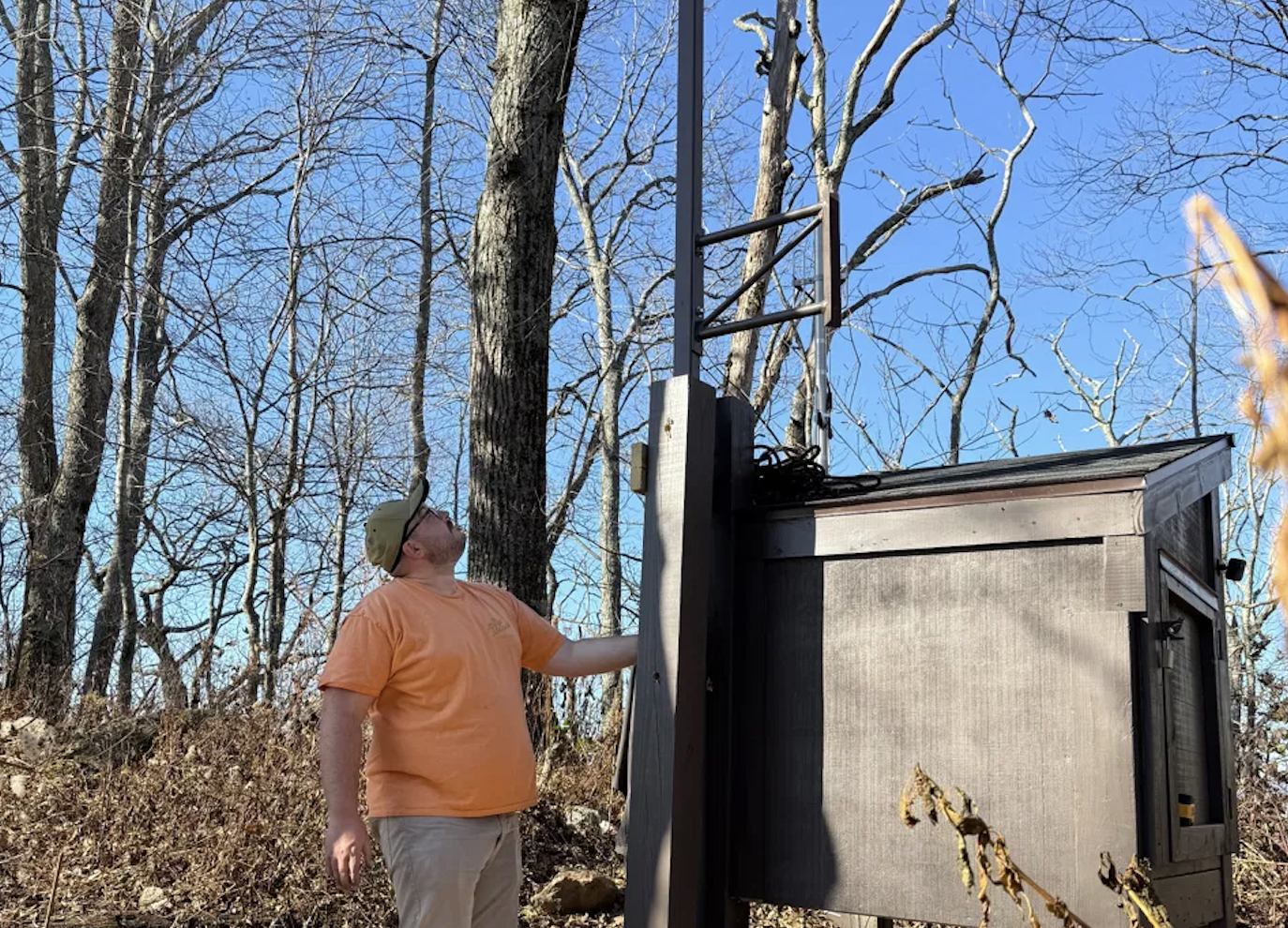 Man building a radio repeater.