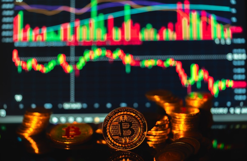 How Much Money Can You Get from Gaming in Canada? Opportunities and Insights Golden Bitcoin coins in front of a financial graph, symbolizing cryptocurrency market trends.