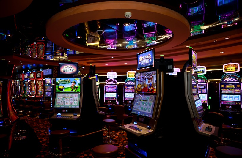 How Regulation Has Changed the Online Casino Industry Vibrant casino floor with colorful slot machines and bright lights capturing a lively gaming atmosphere.