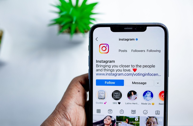 The Only 3 Instagram Growth Companies Worth Your Money Close-up of a smartphone displaying the Instagram app, emphasizing social media connection.