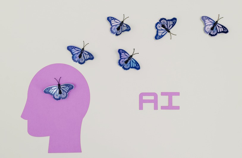 The AI Testing Revolution: What It Means for Your Business Right Now Surreal AI conceptual art featuring butterflies and a human head silhouette in a minimalistic style.