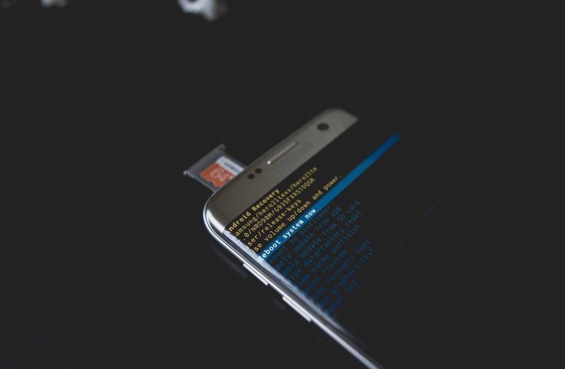 Top 5 Free Data Recovery Software of 2026 Close-up of a smartphone displaying Android recovery mode with an SD card inserted.