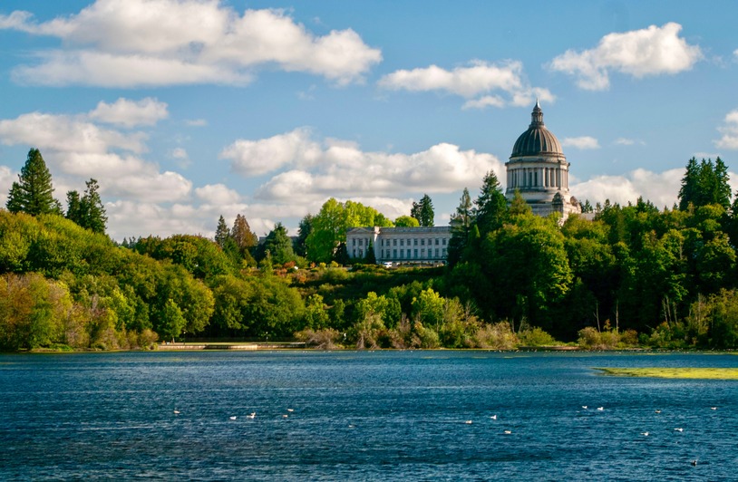 What Happens During Probate in Washington State and How to Avoid It Scenic view of Washington State Capitol and surrounding greenery by the lake in Olympia.