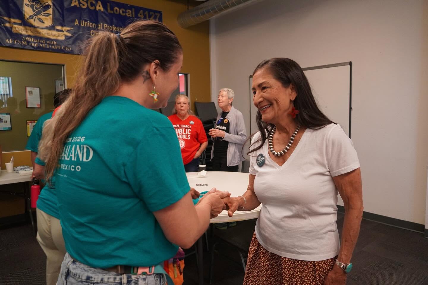 Deb Haaland greets voters during her campaign.