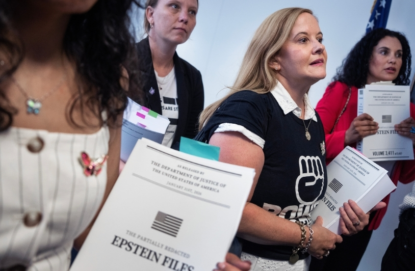 Epstein survivors handing out copies of the Epstein files to Senators.